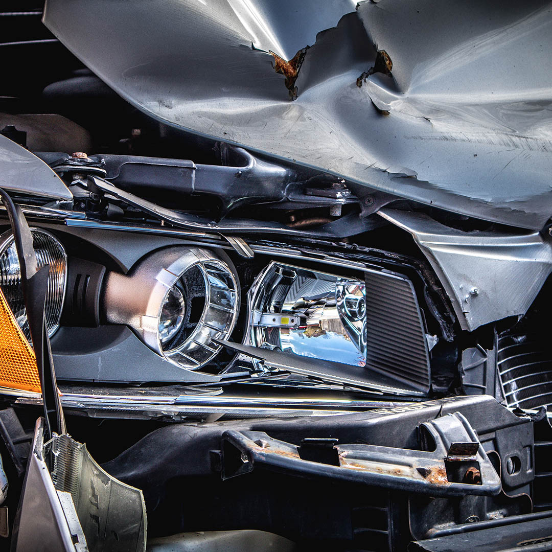 close up of a front of a smashed car