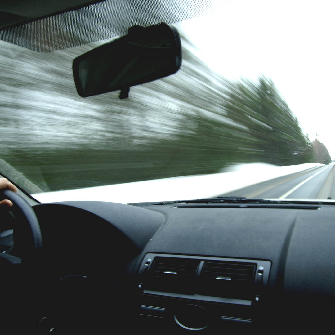 man speeding down the highway